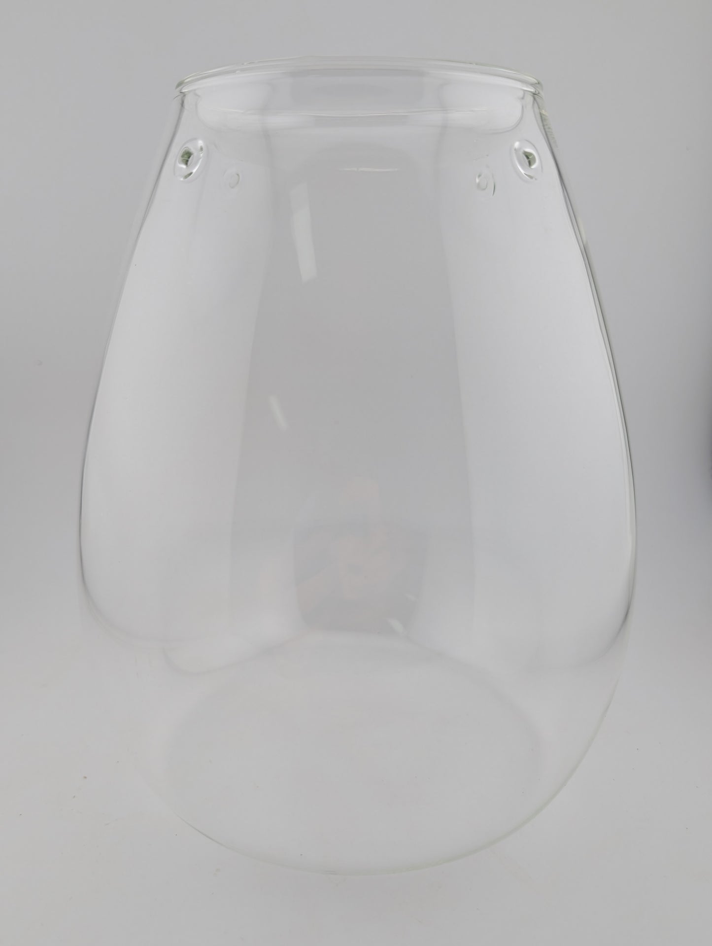 Clear glass vase with a teardrop shape.