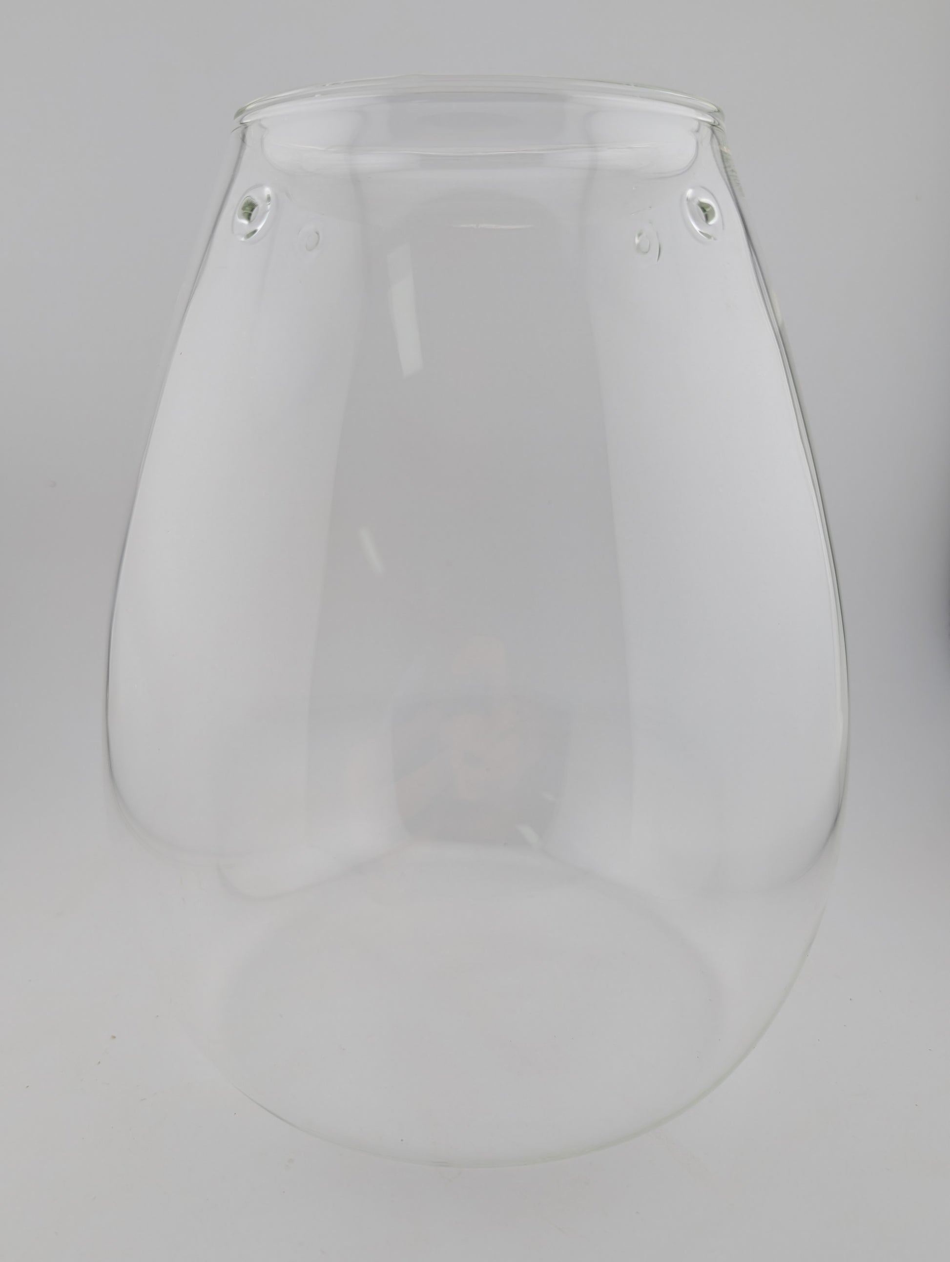 Clear glass vase with a teardrop shape.